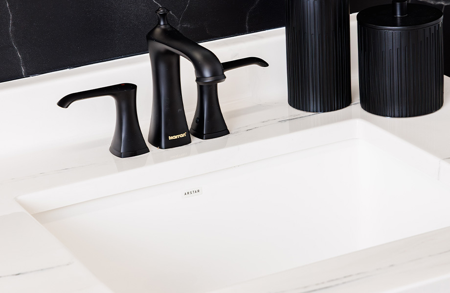 Cultured marble bathroom vanity in Carrara Black with black Karran faucet and soap pump