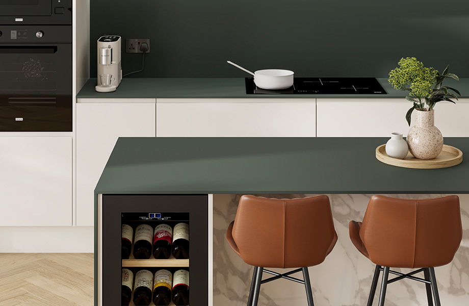 Modern kitchen with FENIX Verde Comodoro countertops, white cabinets, stove and brown bar stools